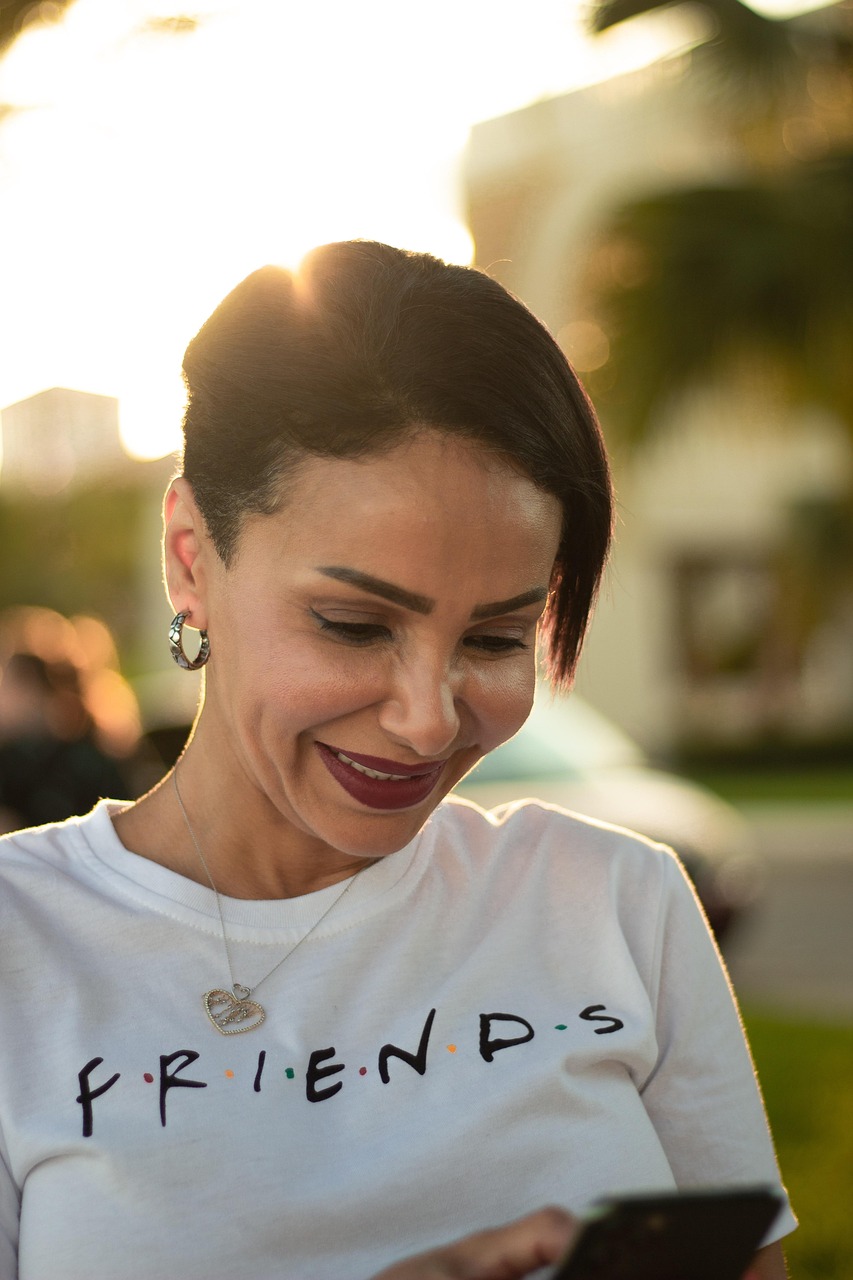woman, friends, television, t-shirt, smile, outdoors