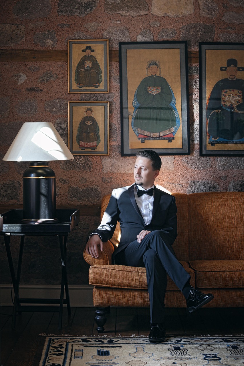 groom, man, portrait, suit, tux, tuxedo, sit, sitting, couch, living room, sitting man, male portrait, young man, male, male model, man, suit, suit, suit, suit, tuxedo, living room, living room, living room, living room, living room, male model
